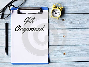 Phrase get organised written on paper clipboard