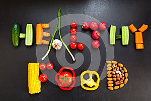 The phrase `Healthy food` is made from fresh vegetables and nuts.