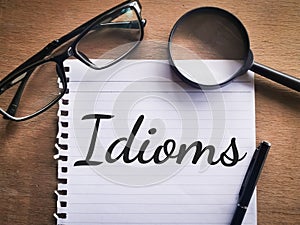 Phrase IDIOMS written on a piece of paper