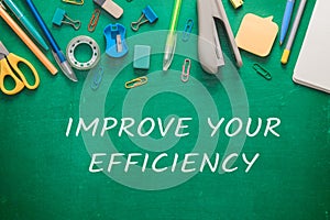 Phrase Improve Your Efficiency and stationery on schoolboard