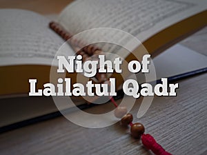Phrase Night of Lailatul Qadr with blurry background.