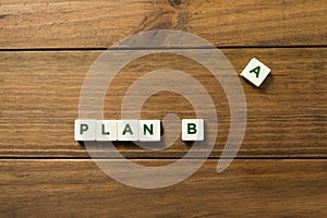 Phrase PLAN B made up of pieces with letters