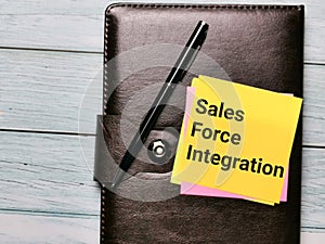 Phrase sales force integration written on sticky note with a pen.