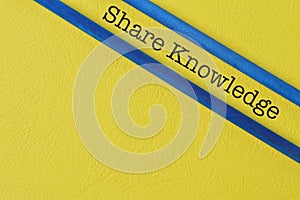 Phrase SHARE KNOWLEDGE isolated on yellow background
