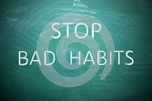 Phrase Stop Bad Habits on green chalkboard