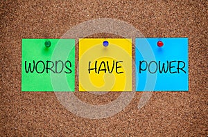 Phrase Words Have Power on corkboard.