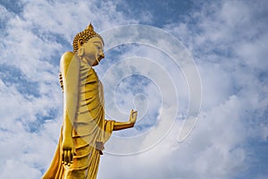 Phu khok ngio big buddha with beautiful blue sky background at chiang khan district loei thailand
