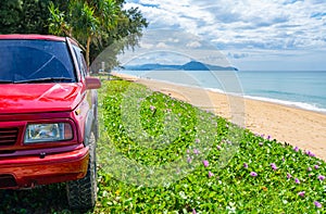 Phuket Thailand 5 December 2023, 4x4 Red car Suzuki Vitara 1993 on the dirt road,Beautiful sea landscape view at sunny sky in