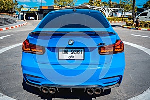 PHUKET, THAILAND- DECEMBER 25, 2023: Beautiful bright blue BMW M3 series in the parking lot.