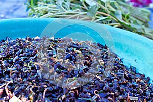 Phuket, Thailand food market: blue bowl holding lemongrass-flavoured crickets