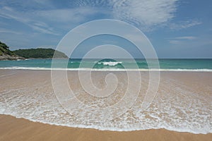 PHUKET, THAILAND- JUL 25, 2017: Crowds of tourists at Naihan beach on JUL 25, 2017 in Phuket, Thailand. Phuket is a popular destin