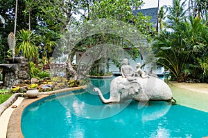 Phuket, Thailand - May, 08, 2022 : Elephant statue in swimming pool of Thavorn Beach Village Resort & Spa at Phuket, Thailand