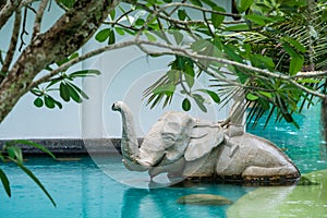 Phuket, Thailand - May, 08, 2022 : Elephant statue in swimming pool of Thavorn Beach Village Resort & Spa at Phuket, Thailand