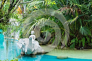 Phuket, Thailand - May, 08, 2022 : Elephant statue in swimming pool of Thavorn Beach Village Resort & Spa at Phuket, Thailand