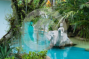 Phuket, Thailand - May, 08, 2022 : Elephant statue in swimming pool of Thavorn Beach Village Resort & Spa at Phuket, Thailand