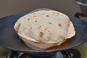 Phulka Chapati roti on non stick tawa.Indian Subcontinent food