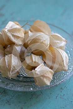 Physalis peruviana ripened orange yellow cape gooseberry goldenberry edible tasty ingredient fruits spread on wooden background