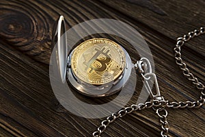 The physical bitcoin and vintage pocket watch shows that time is running out.