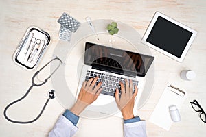 Physical concept. Doctor working with laptop at office