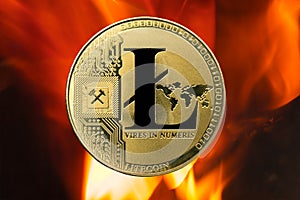 Physical Litecoin gold coin LTC with fire or flame background