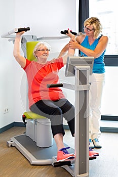 Physical therapist helping patient with exercises