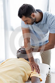 physical therapist treating mature african american