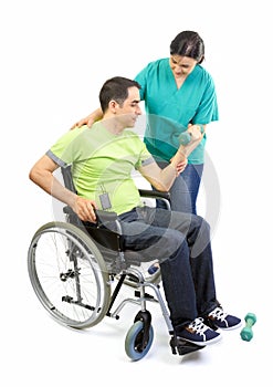 Physical therapist works with patient in lifting hands weights.