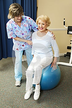 Physical Therapist Works with Senior
