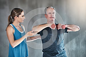 Physical therapy, dumbbell and coaching with old man and personal trainer for support, health and physiotherapy