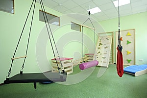 Physical therapy room for Down syndrome children: toys and rehabilitation equipment