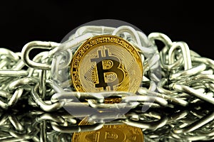 Physical version of Bitcoin new virtual money and chain. Conceptual image for investors in cryptocurrency and Blockchain Technol