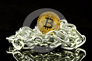 Physical version of Bitcoin new virtual money and chain. Conceptual image for investors in cryptocurrency and Blockchain Technol