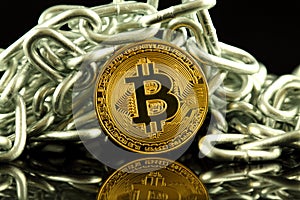 Physical version of Bitcoin new virtual money and chain. Conceptual image for investors in cryptocurrency and Blockchain Technol