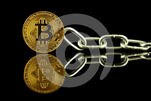 Physical version of Bitcoin virtual money and chain. Conceptual image for Blockchain Technology and hard fork