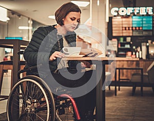 Physically challenged women in a cafe