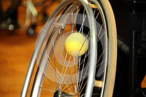 Physically disabled athlete playing tennis in wheelchair