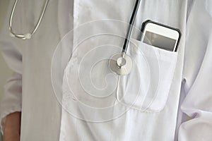 Physician doctor carrying stethoscope and mobile phone