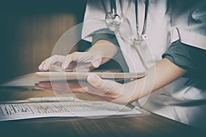 physician doctor medical practitioner using tablet at clinic hos