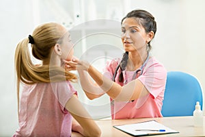 Physician examining kid at office