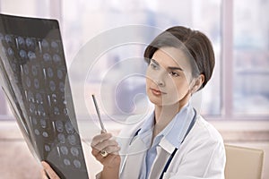 Physician examining x-ray