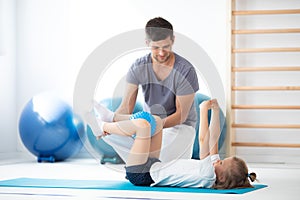 Physician explain to child how to perform an exercise