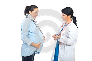 Physician giving prescription to pregnant