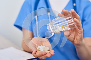 Physician Holding Pill Bottle