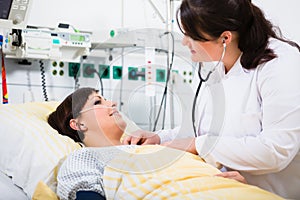 Physician for intensive medicine in hospital checking patient