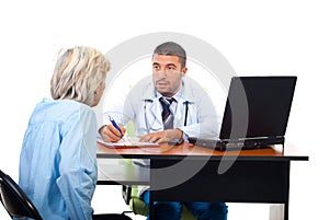 Physician man explaining to senior woman