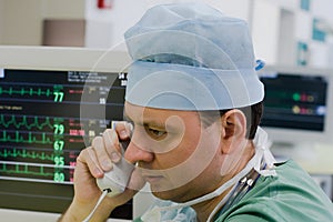 Physician with phone in ICU