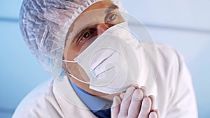 Physician praying in hospital