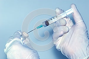 Physician prepares a vaccine