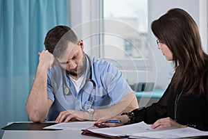 Physician talking with lawyer