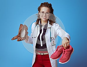 Physician woman with high heel shoes giving fit sneakers